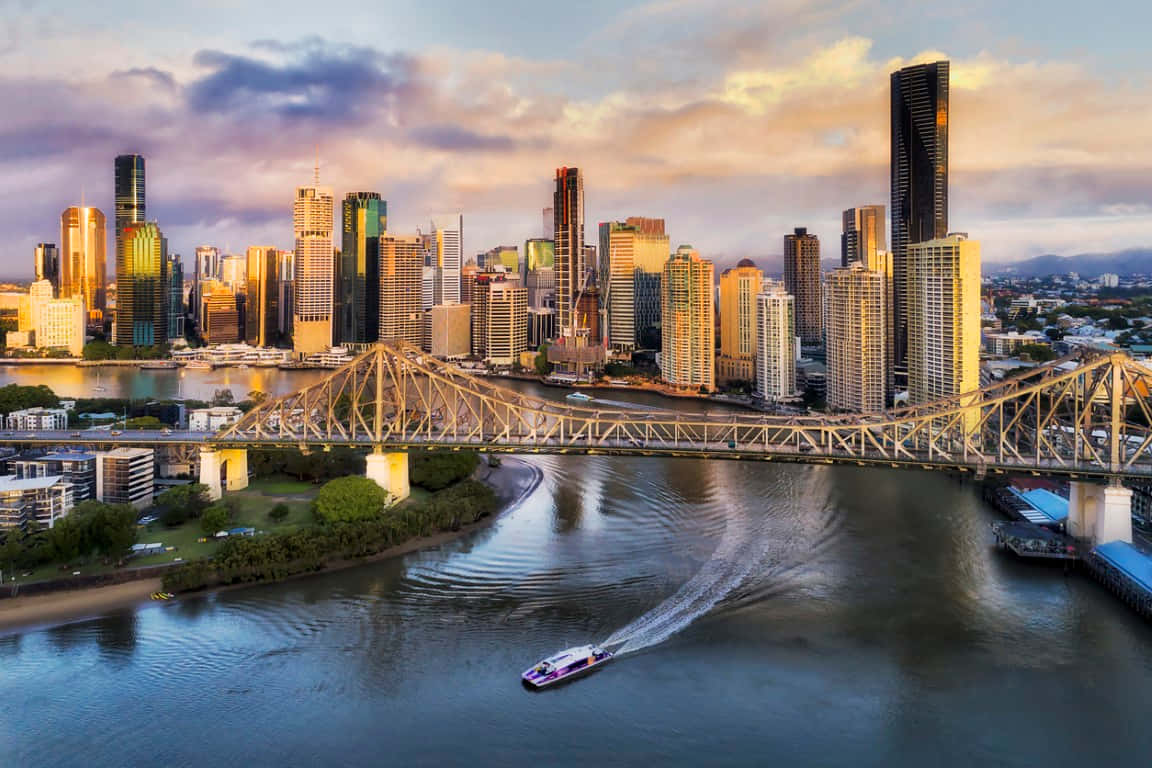 Breathtaking Sunset Over Brisbane Skyline Wallpaper