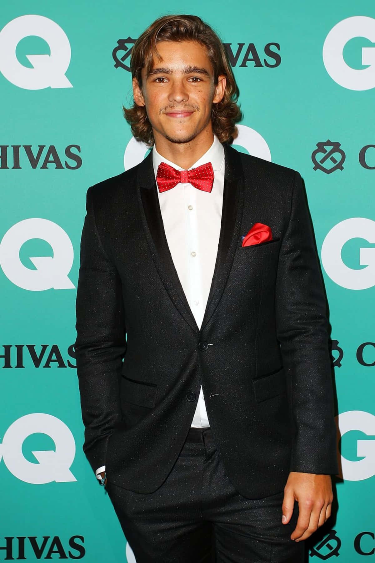 Brenton Thwaites Red Bow Tie Event Wallpaper