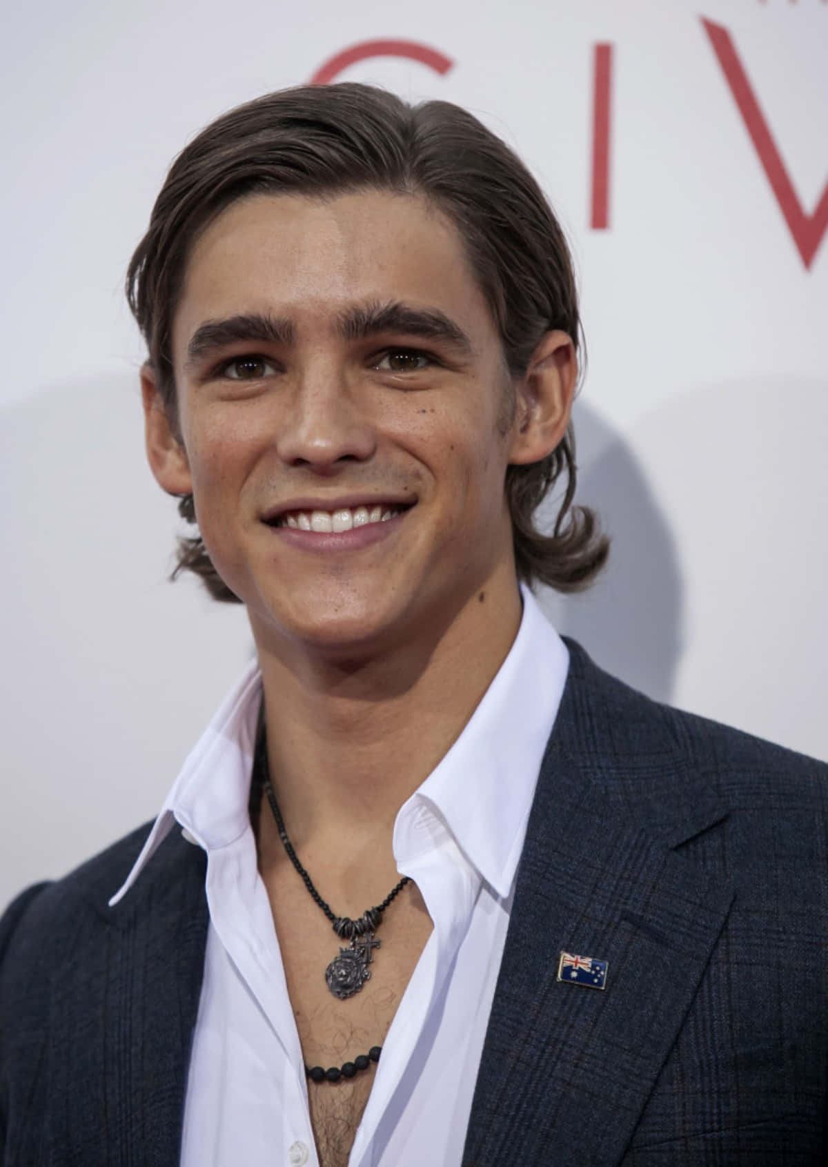 Brenton Thwaites Red Carpet Smile Wallpaper