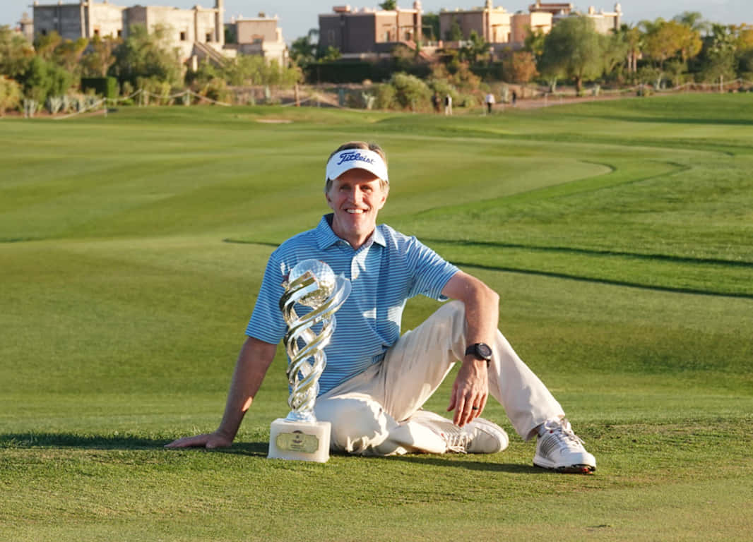 Brett Quigley Sitting With Trophy Wallpaper