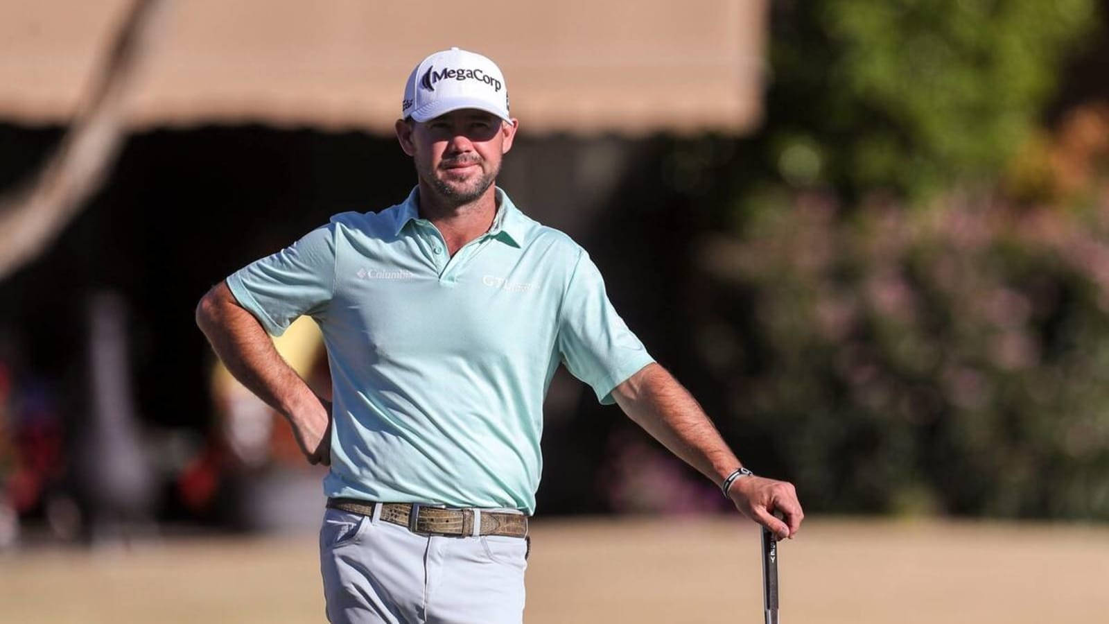 Brian Harman Leaning On Golf Club Wallpaper