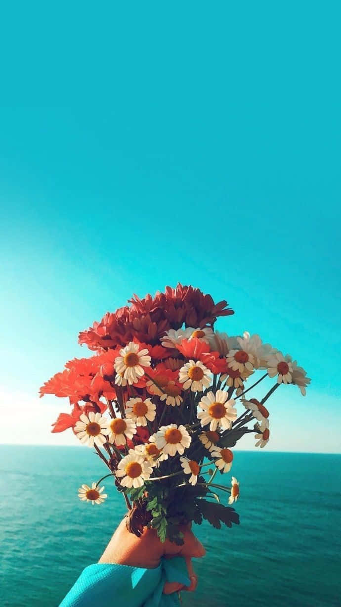 Bright Aesthetic Bouquet Over Sea Wallpaper