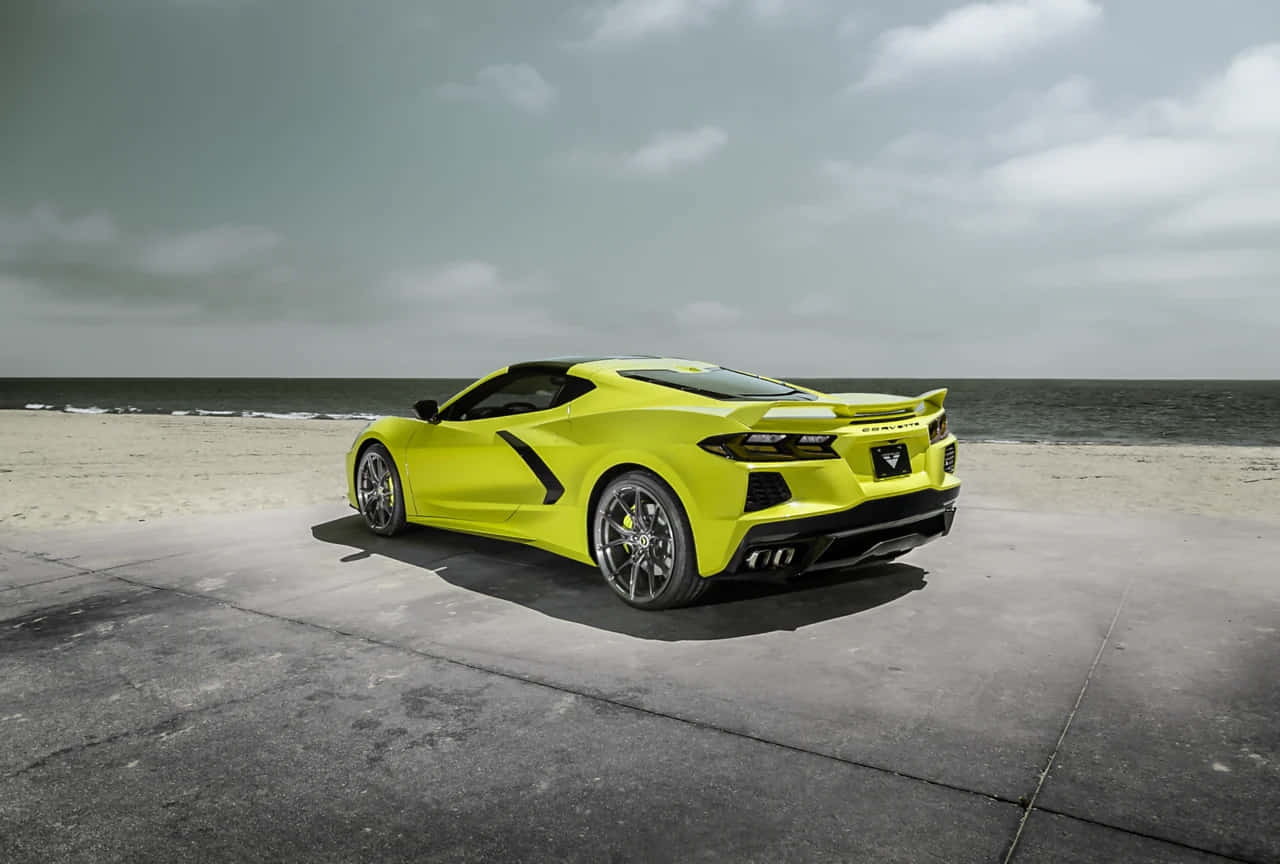 Bright Yellow Corvette C8on Beachfront Wallpaper