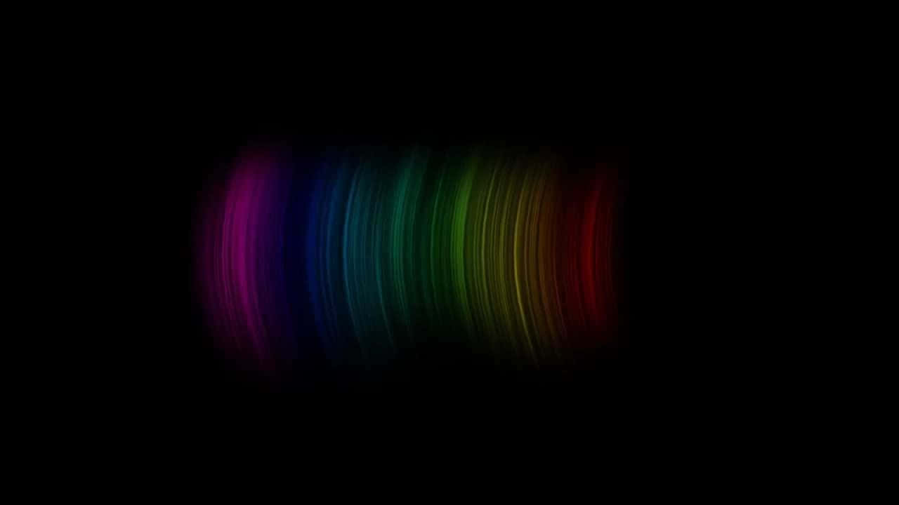 Brightly Colored Rainbow Cutting Through A Pitch Black Sky. Wallpaper