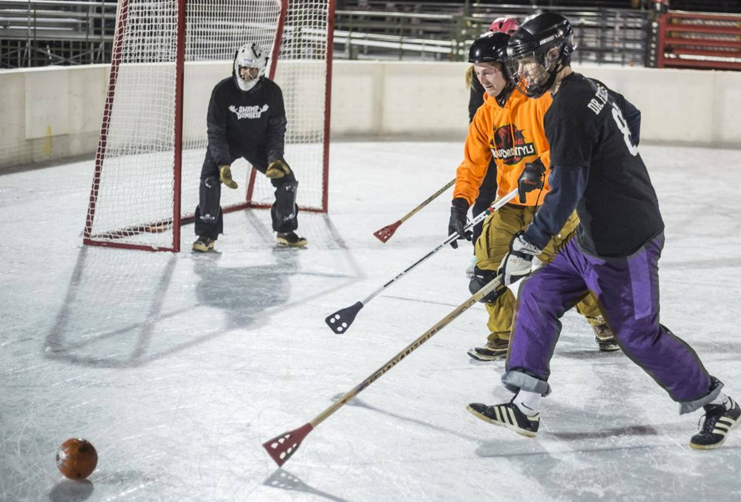 Broomball Orange And Black Team Wallpaper