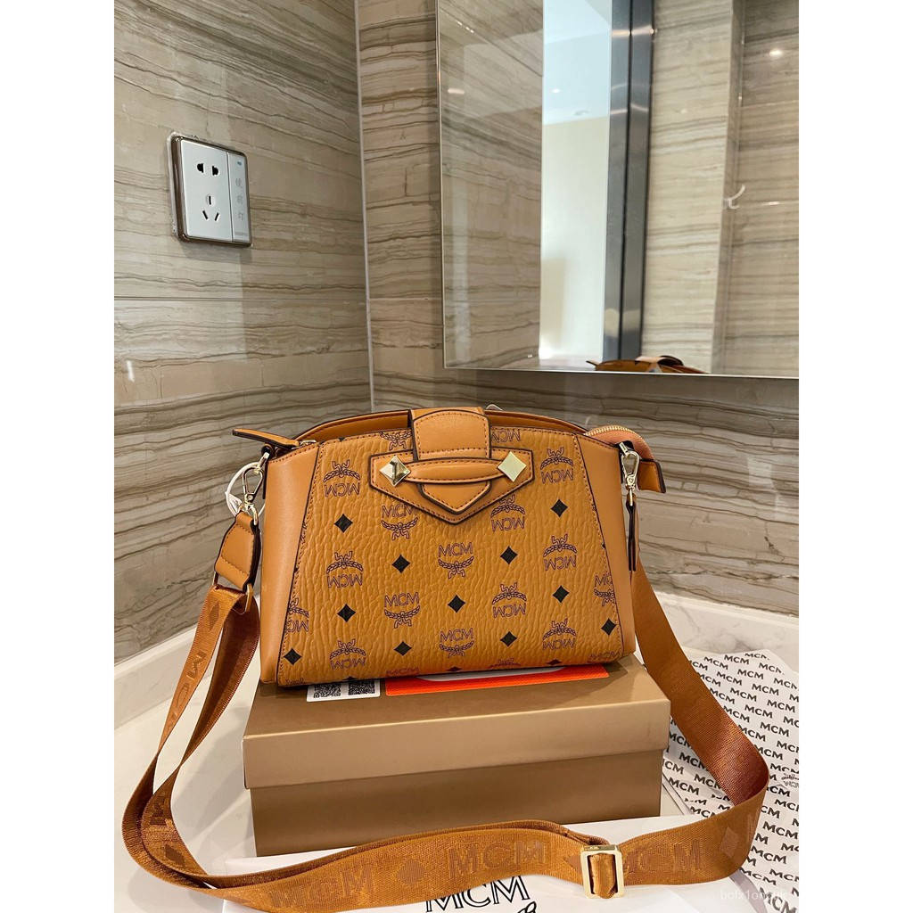 Brown Mcm Leather Sling Bag Wallpaper