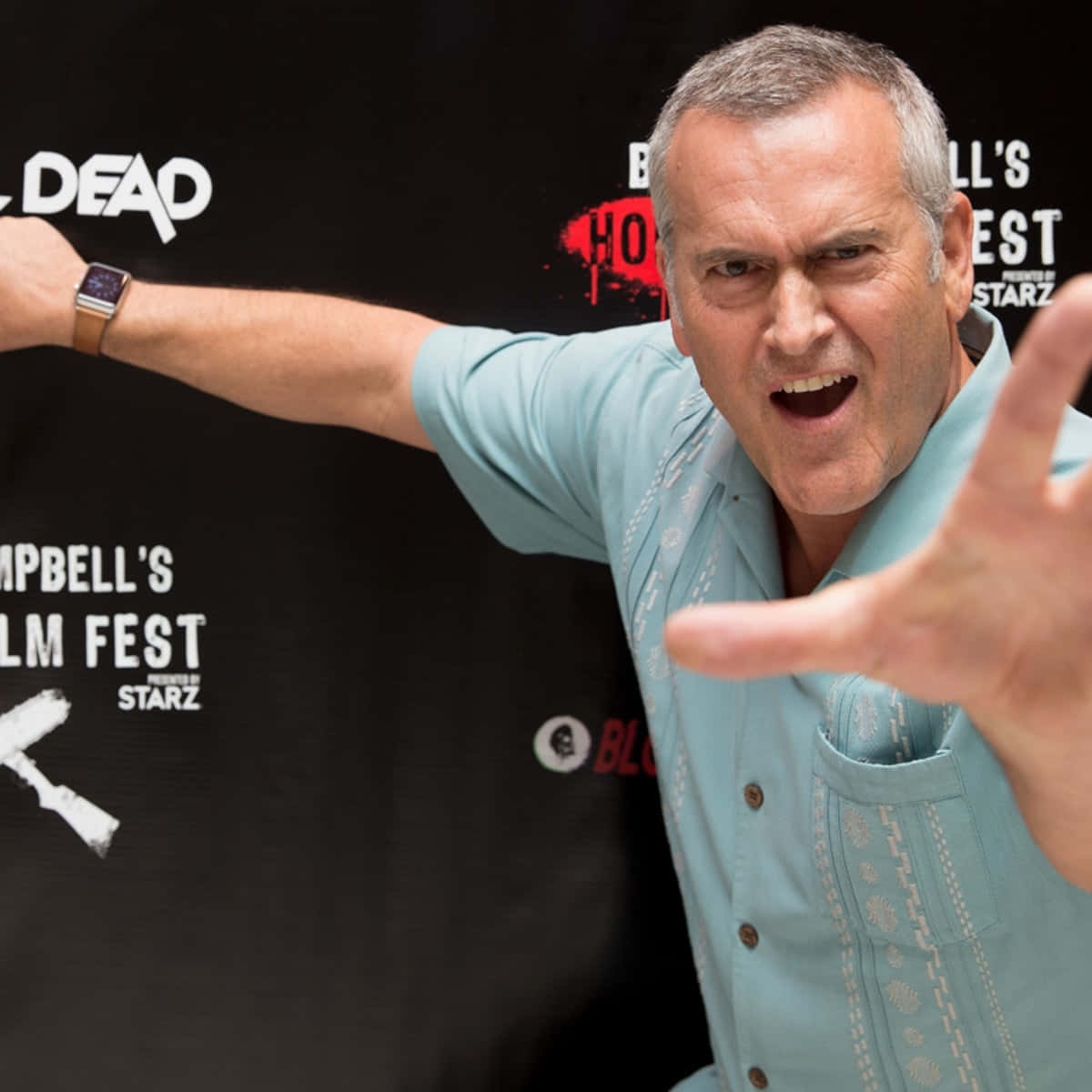 Bruce Campbell In Character - A Master Of Horror Comedy Wallpaper