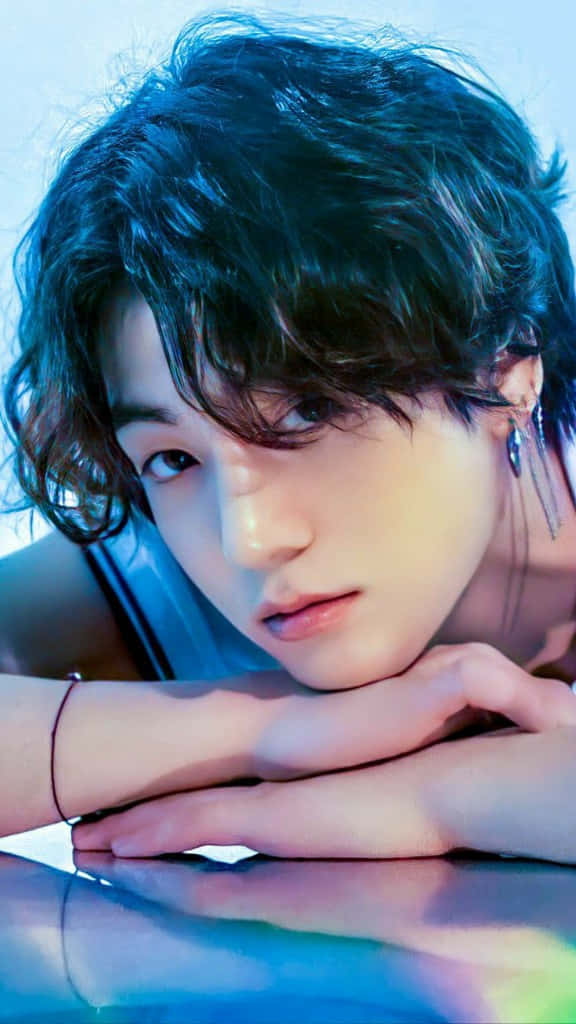 Bts' Jungkook Rocks Long Hair As He Strikes A Handsome Pose Wallpaper