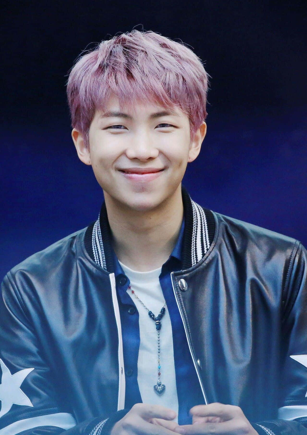 Bts Rap Monster In Dynamic Performance Pose Wallpaper