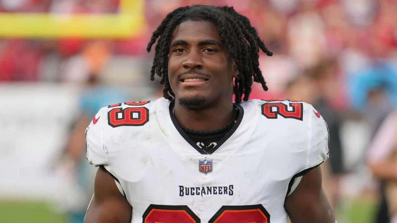 Buccaneers Player Smiling On Field Wallpaper