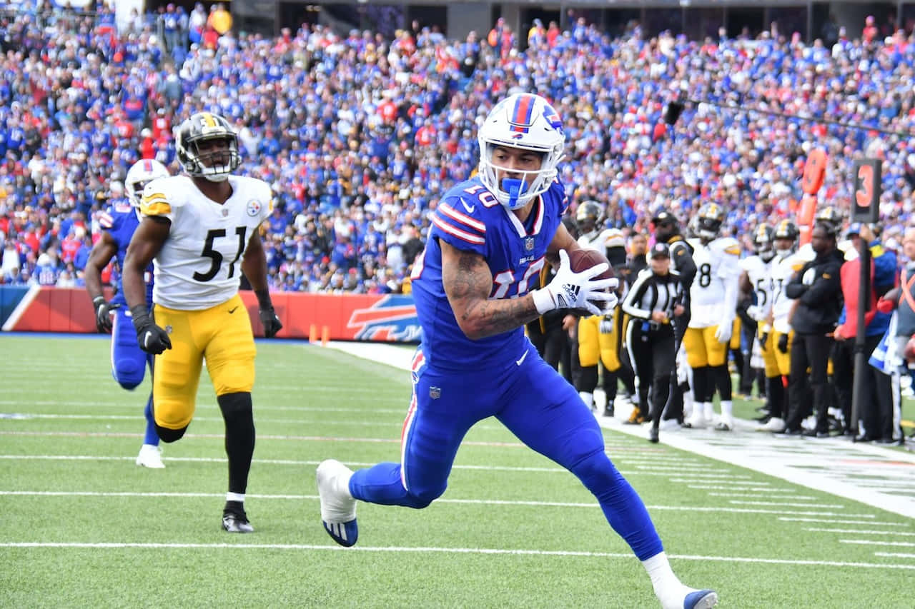 Buffalo Bills Player Catching Football During Game Wallpaper