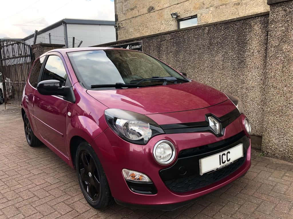 Burgundy Renault Twingo Parked Wallpaper