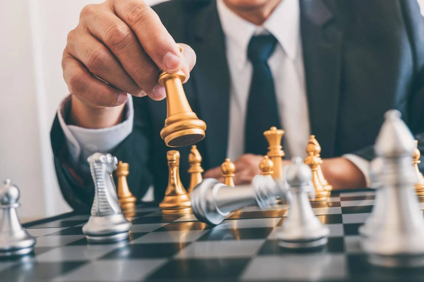 Businessman Strategizing With A Game Of Chess Wallpaper