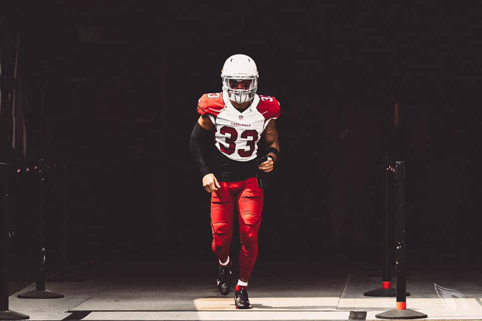 Byron Murphy Showcasing His Football Skills On The Field Wallpaper