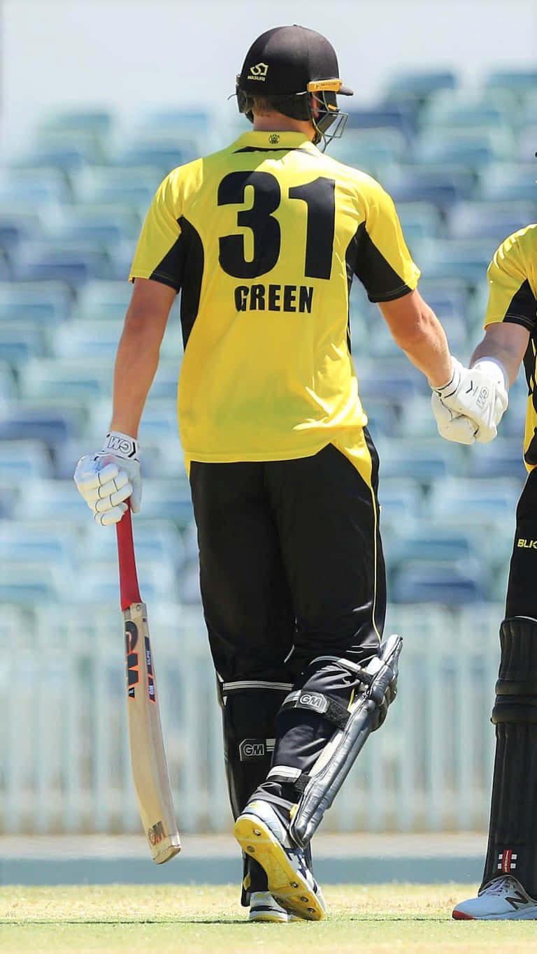 Cameron Green In Action During A Cricket Match Wallpaper