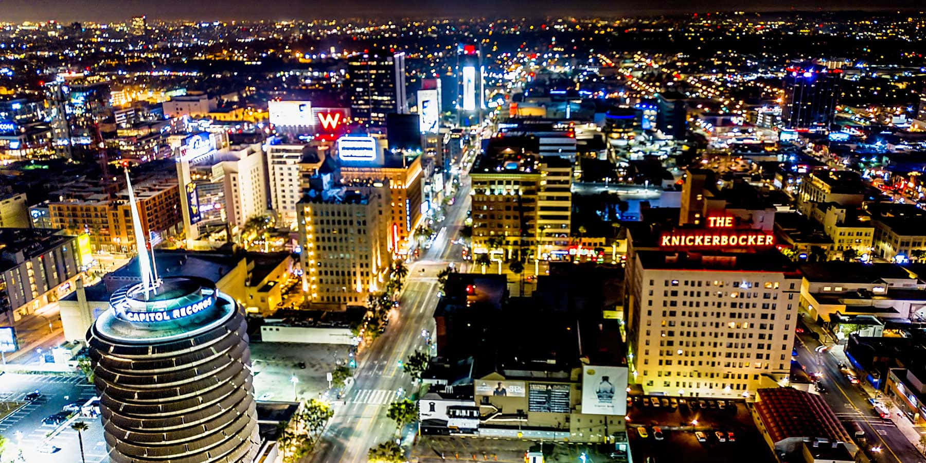 Capitol Records Building Illuminated By Lights Wallpaper