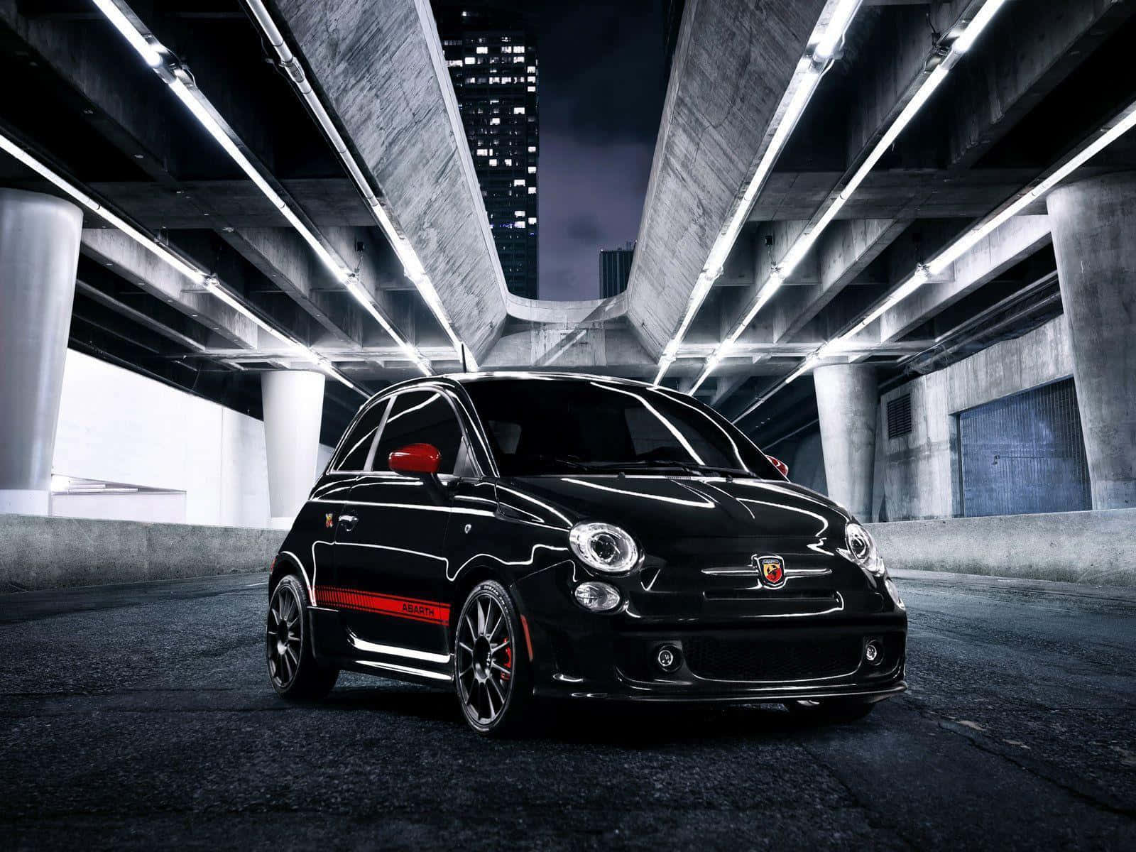 Caption: Abarth Sports Car Captured In A Dynamic Setting, Reflecting Speed And Precision. Wallpaper