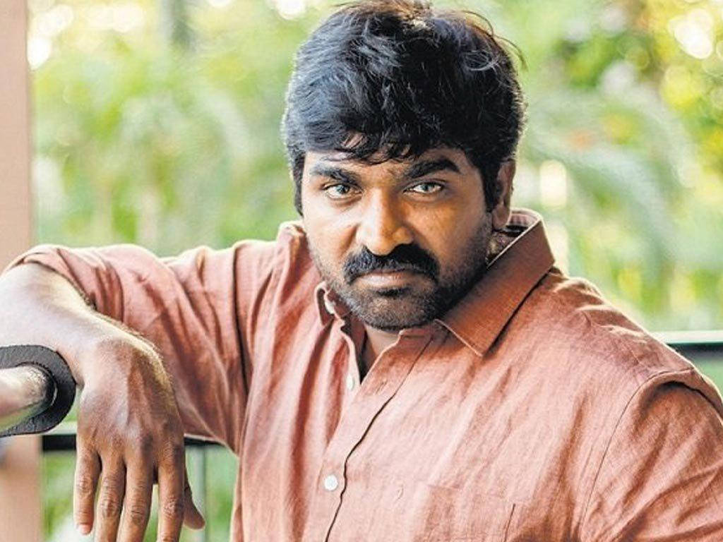 Caption: Actor Vijay Sethupathi Striking A Pose In A Brown Shirt. Wallpaper