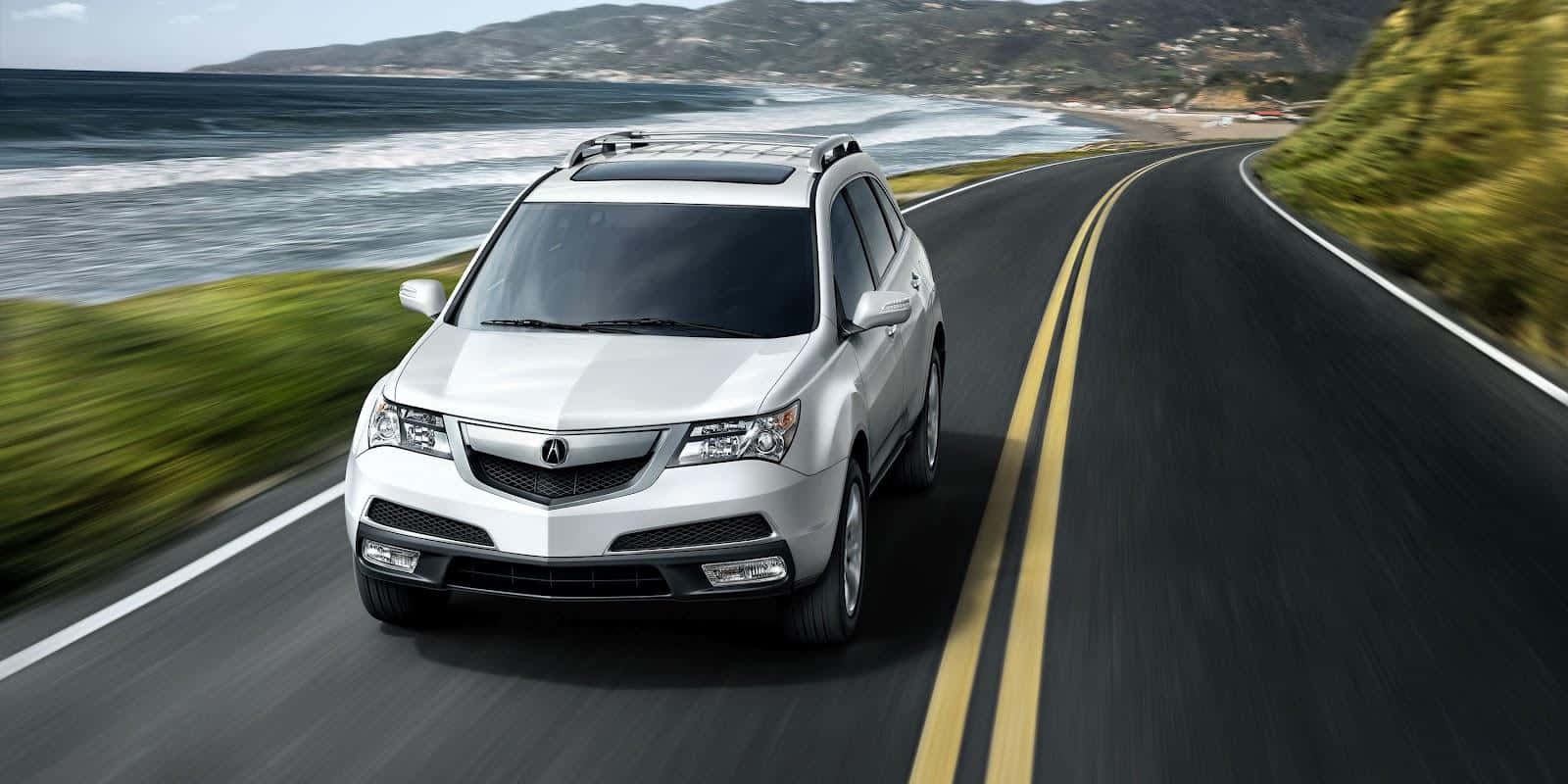 Caption: Acura Mdx - Luxury Crossover Suv On The Move Wallpaper