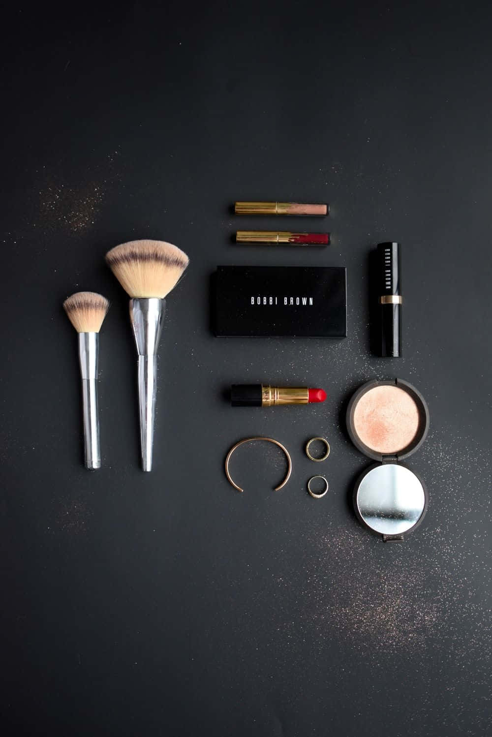 Caption: Adorable Makeup Essentials Flatlay Wallpaper