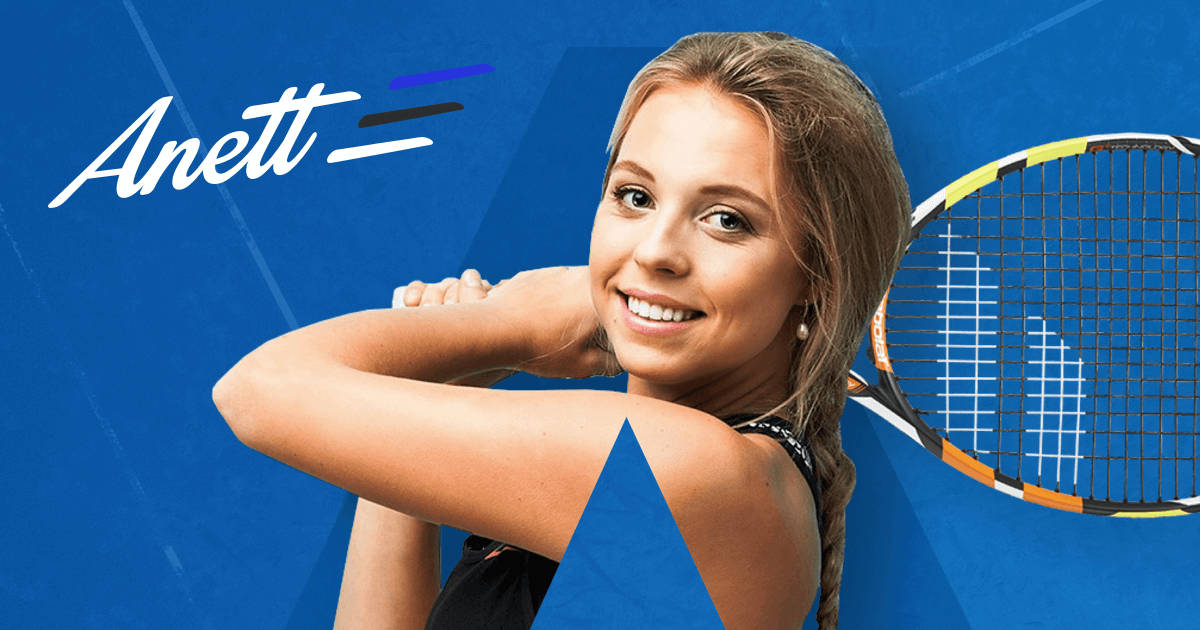 Caption: Anett Kontaveit Smiling Against A Blue Backdrop Wallpaper