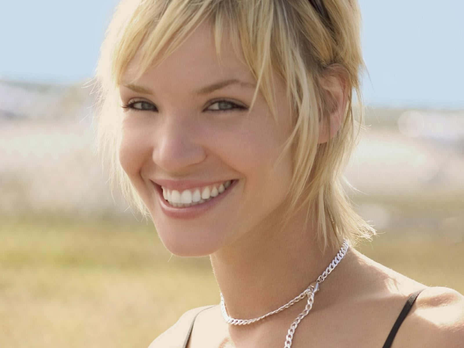 Caption: Ashley Scott Striking A Pose Wallpaper