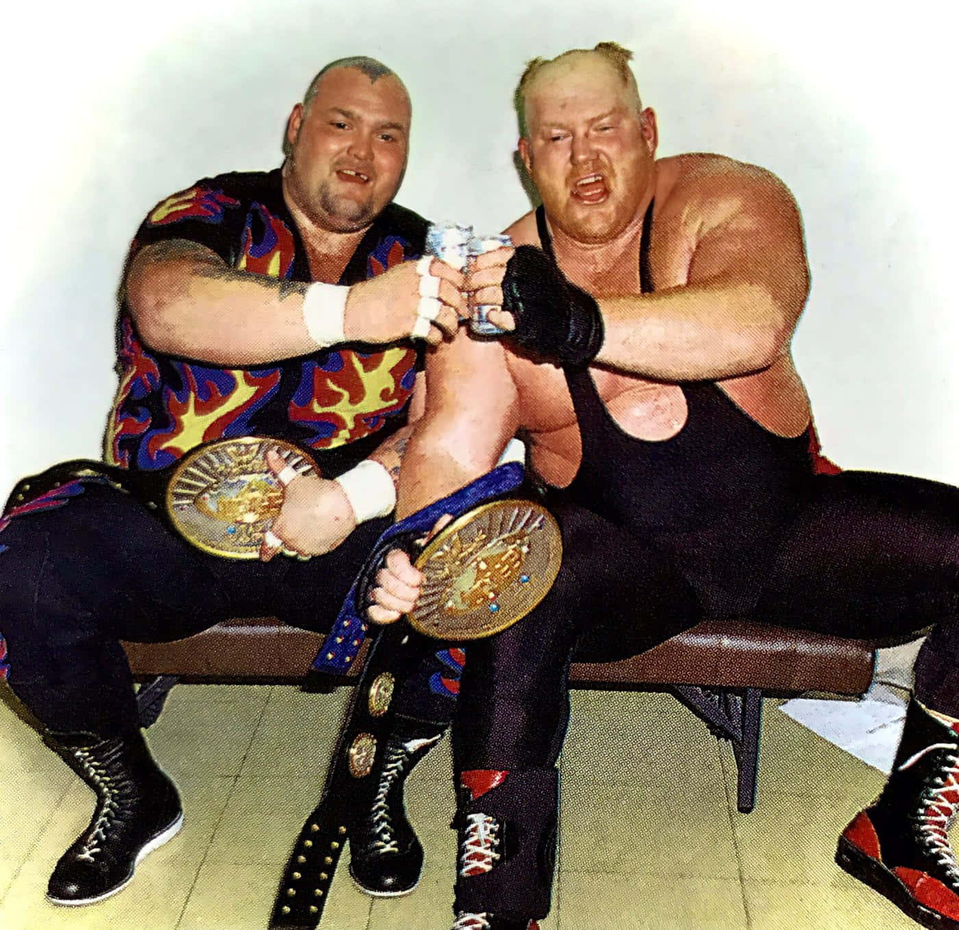 Caption: Bam Bam Bigelow And Big Van Vader Celebrating Victory Wallpaper