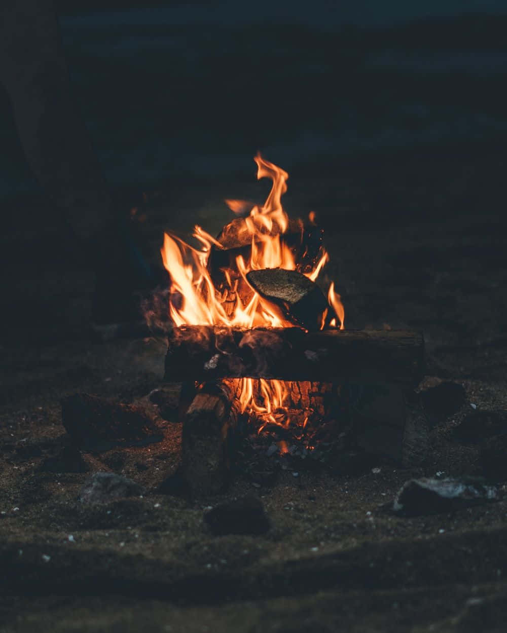 Caption: Beach Bonfire Illuminating The Night Wallpaper