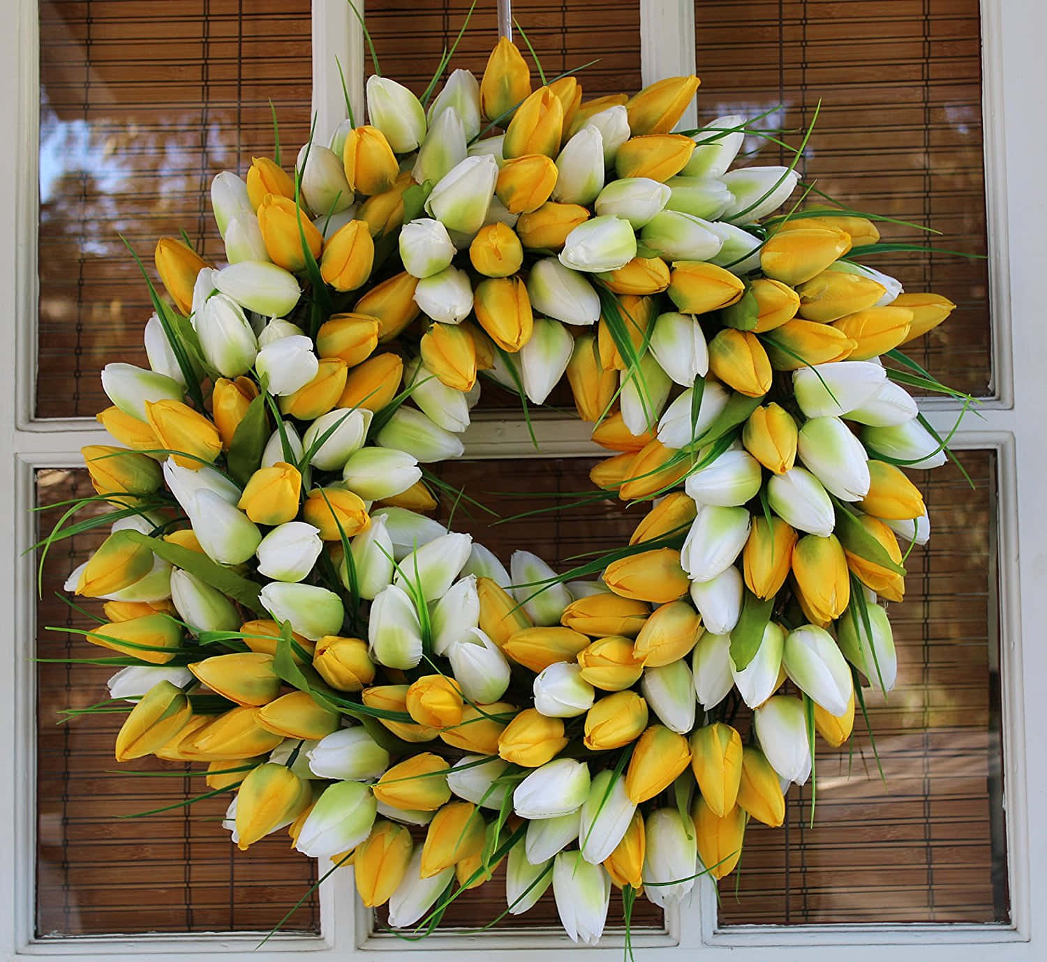 Caption: Beautiful Spring Wreath With Colorful Flowers On Rustic Wooden Door Wallpaper