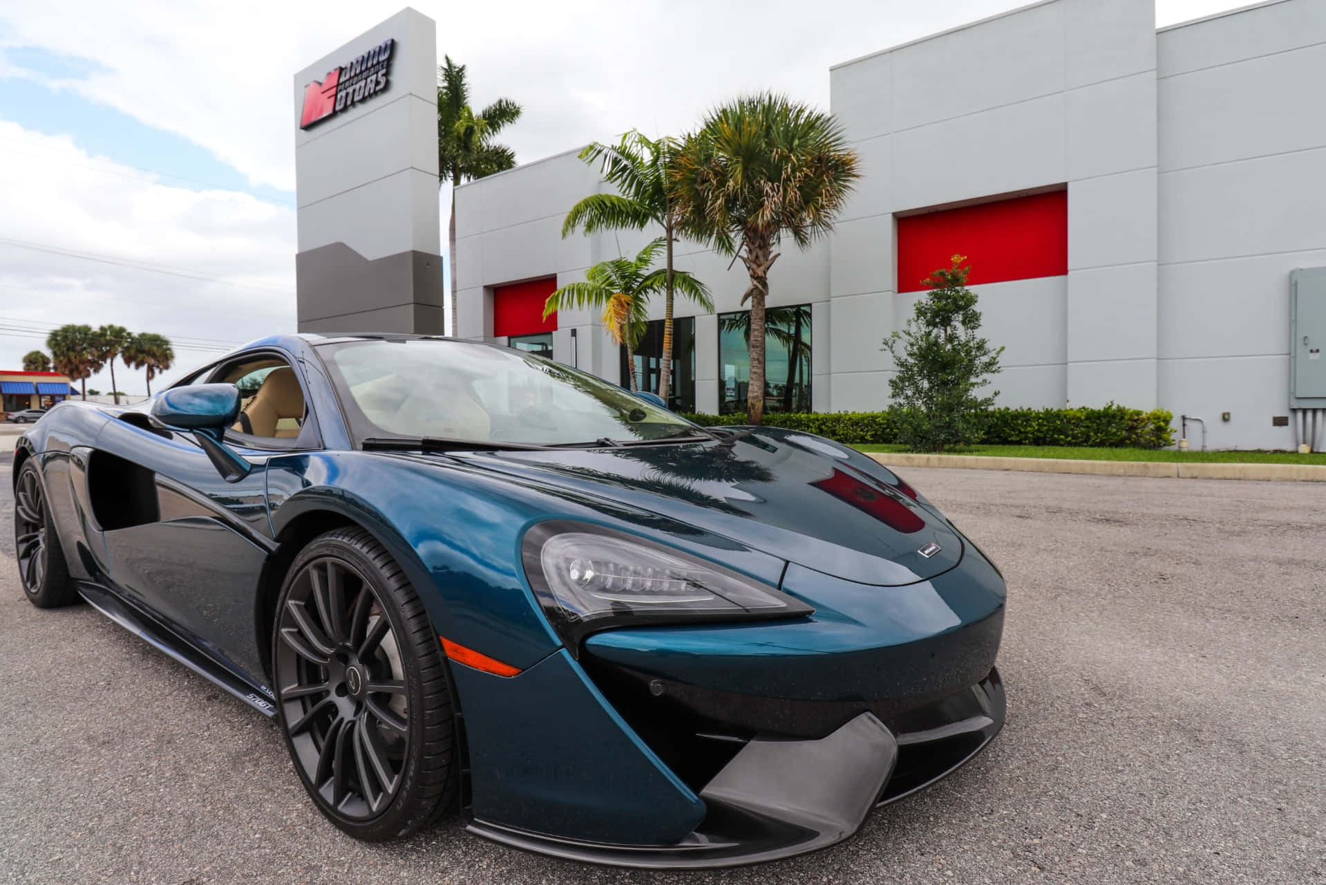 Caption: Breathtaking Mclaren 570gt Amidst The Prestige Of Nature Wallpaper