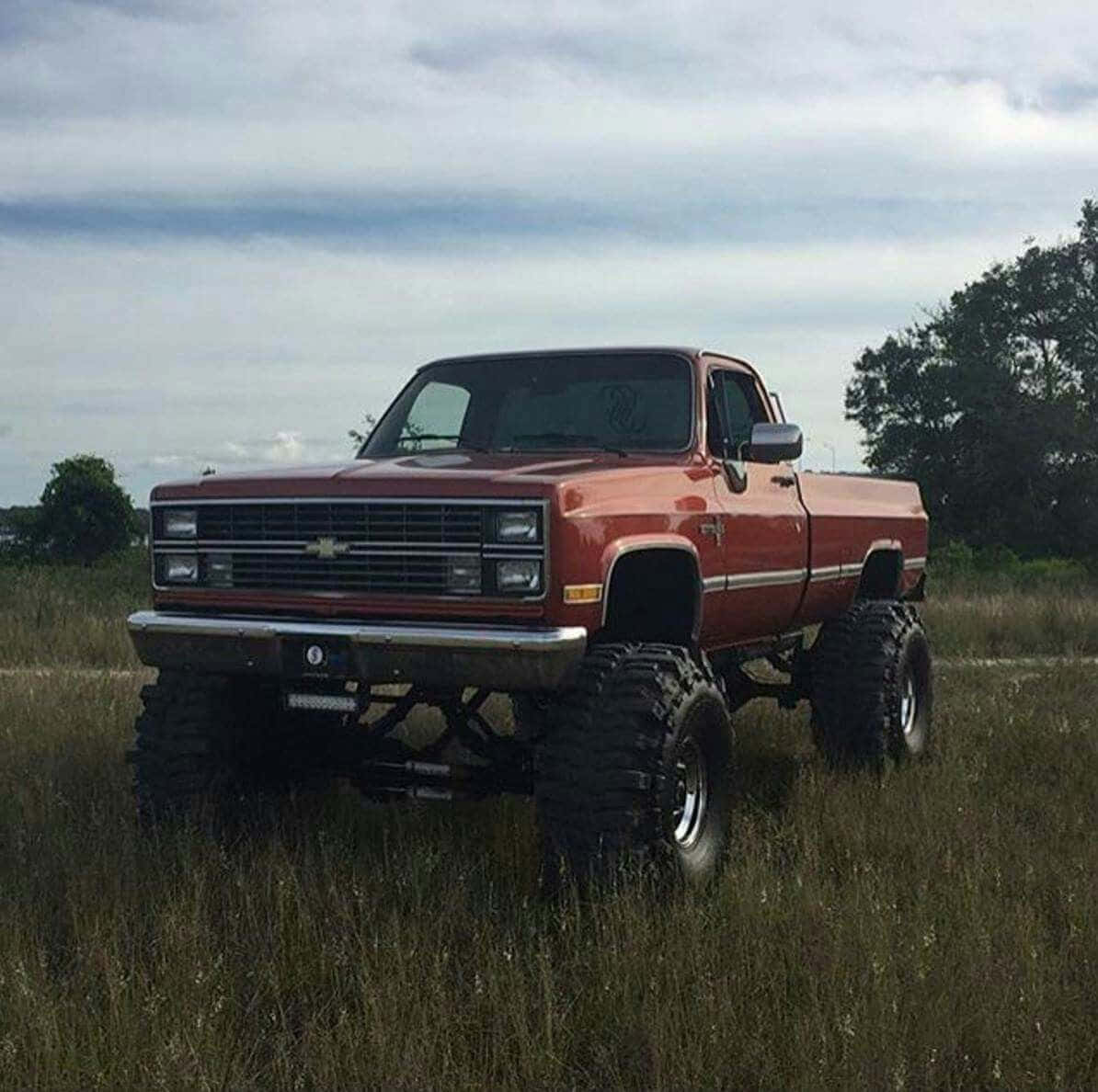 Caption: Classic Square Body Truck In Full Glory Wallpaper