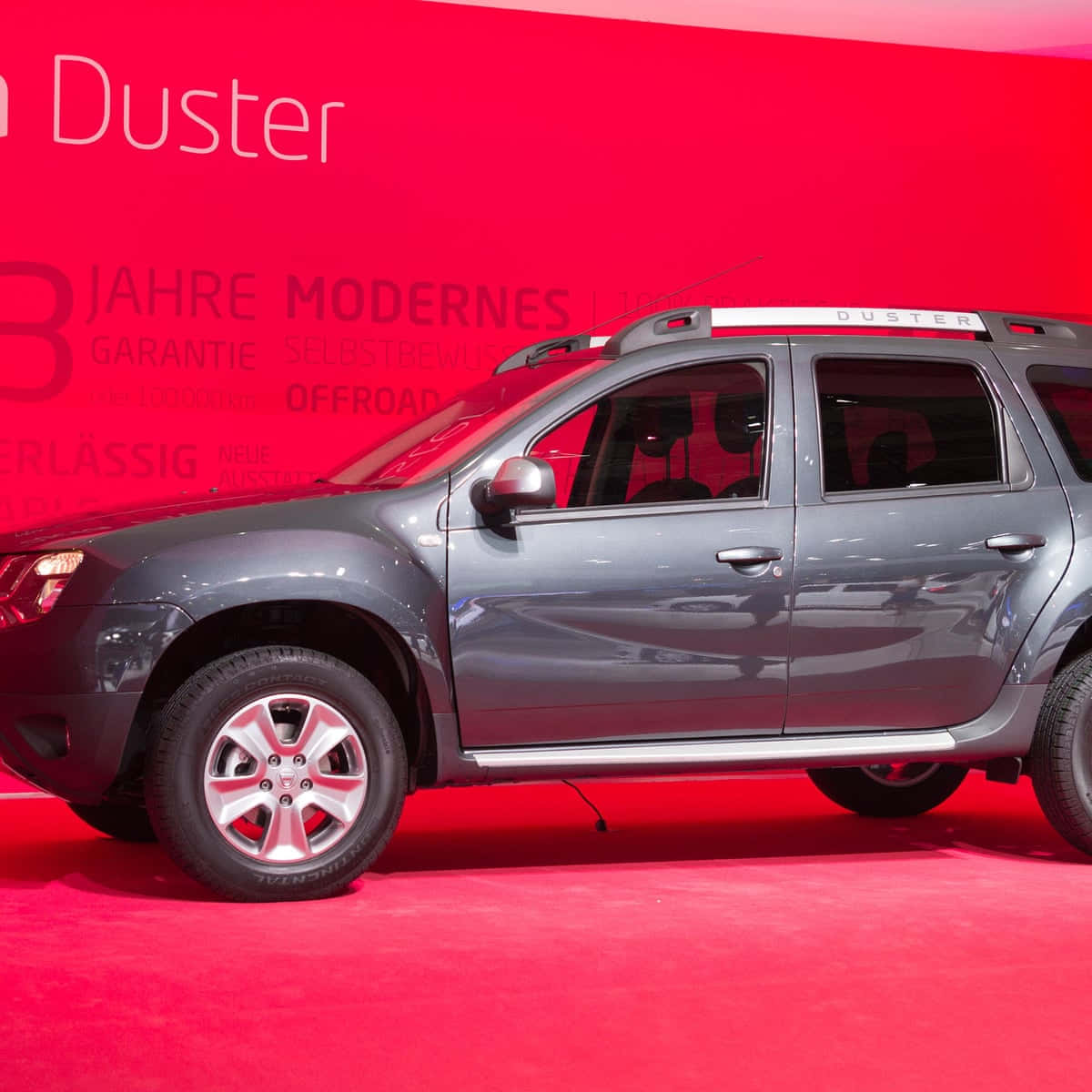 Caption: Dacia Duster Cruising Through The Outdoors Wallpaper