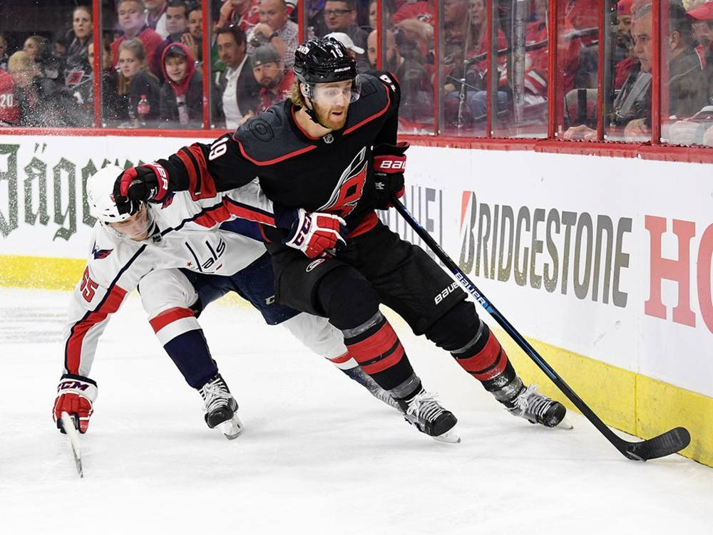 Caption: Dougie Hamilton In Action Against Andre Burakovsky Wallpaper