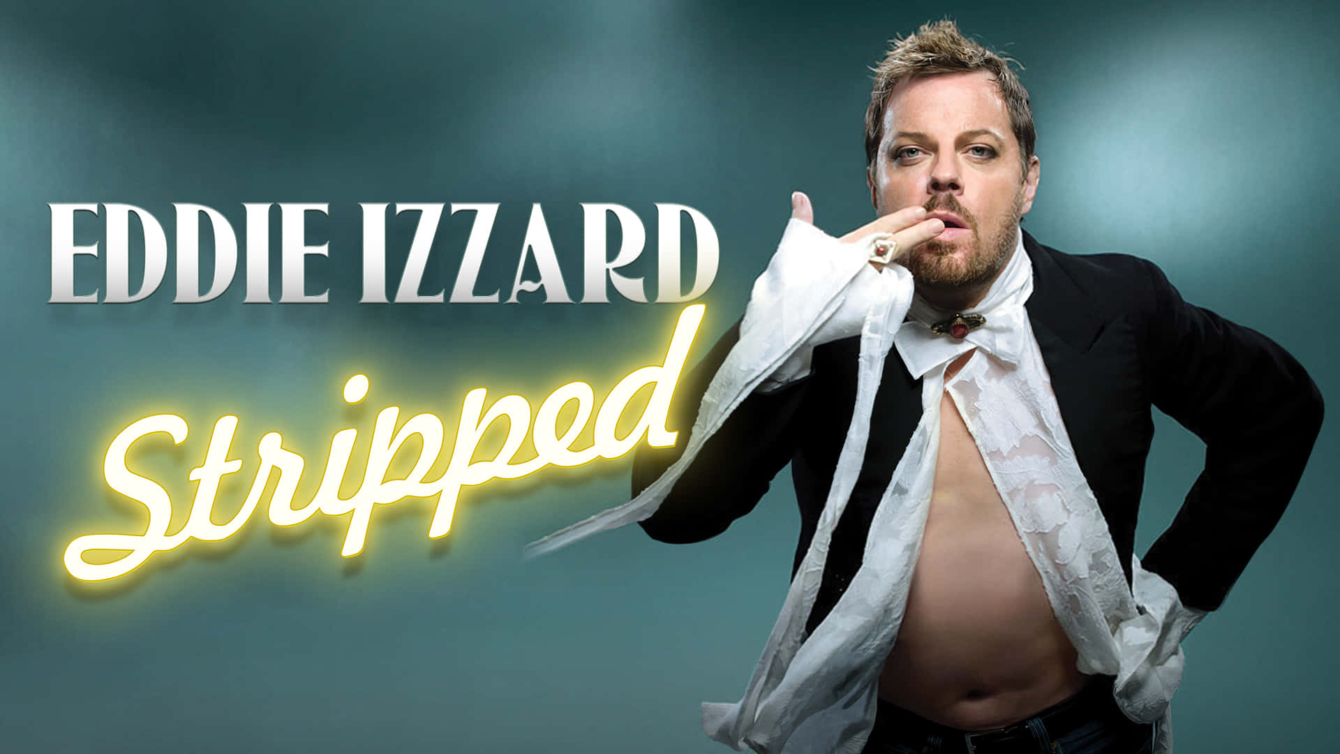 Caption: Eddie Izzard On Stage During A Live Performance Wallpaper