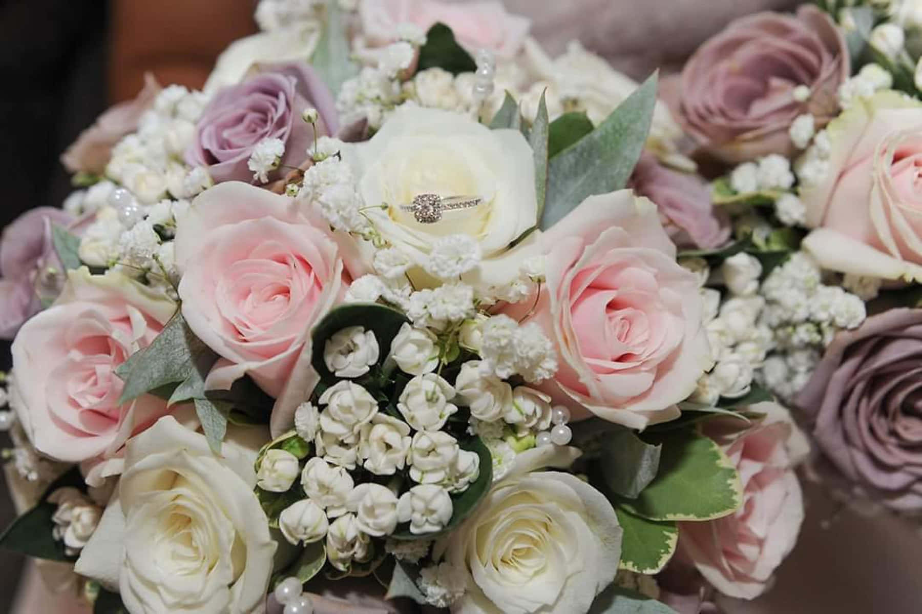 Caption: Elegant Wedding Bouquet In Bride's Hands Wallpaper