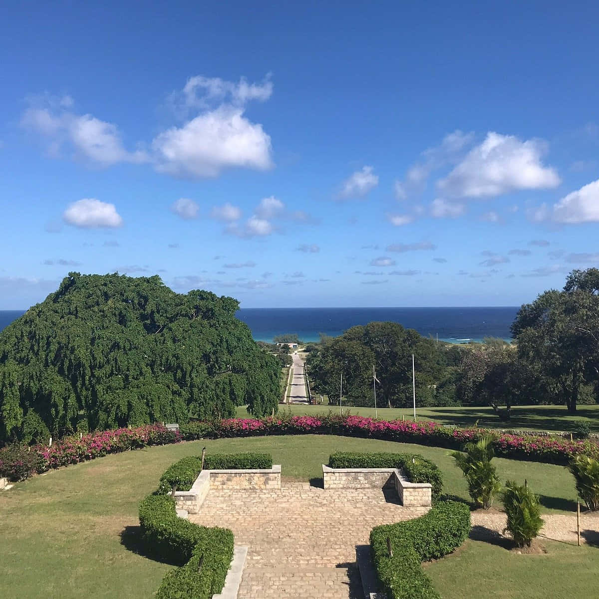 Caption: Enchanting View Of Rose Hall Great House Overlooking The Ocean Wallpaper