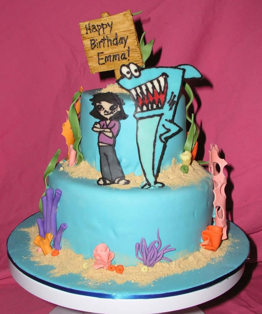 Caption: Fun And Vibrant Kenny The Shark Themed Cake Wallpaper