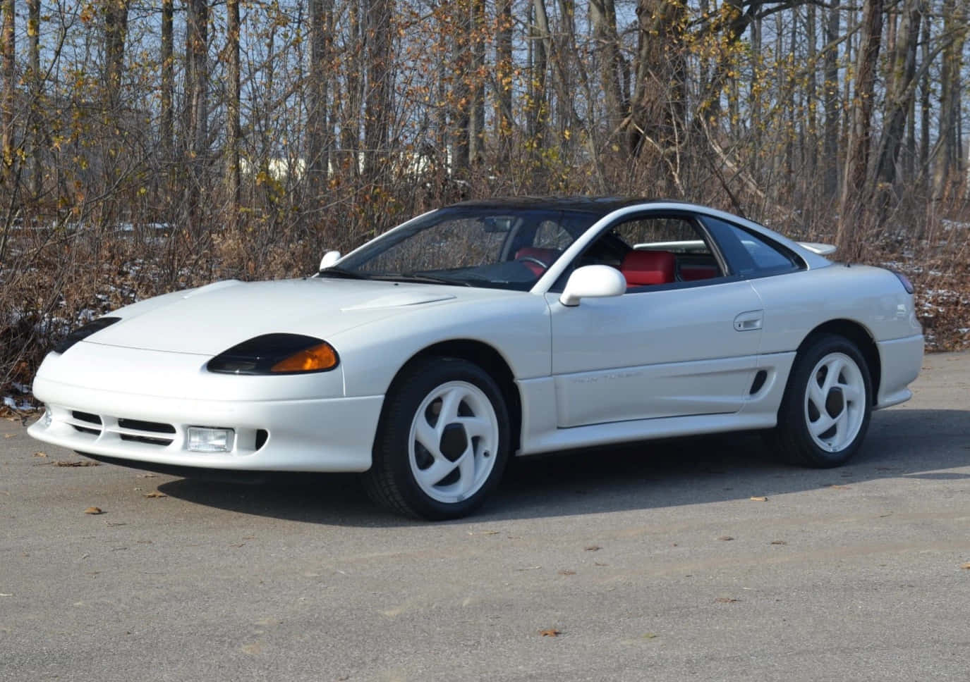 Caption: Gleaming 1991 Dodge Stealth On A Scenic Route Wallpaper