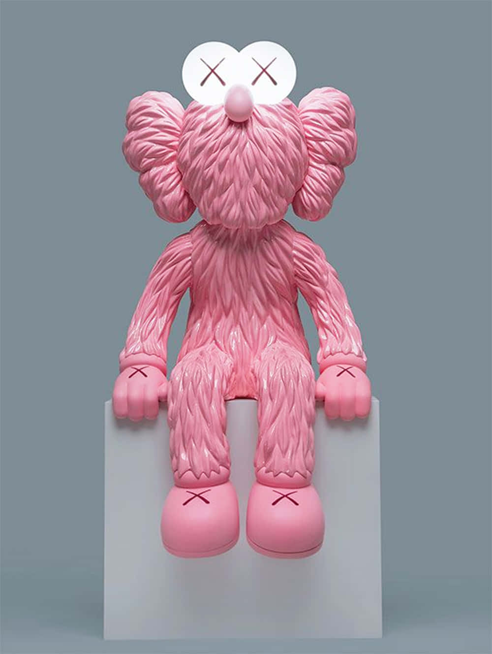 Caption: Kaws Bff Pink Artwork Displayed On A Wall Wallpaper