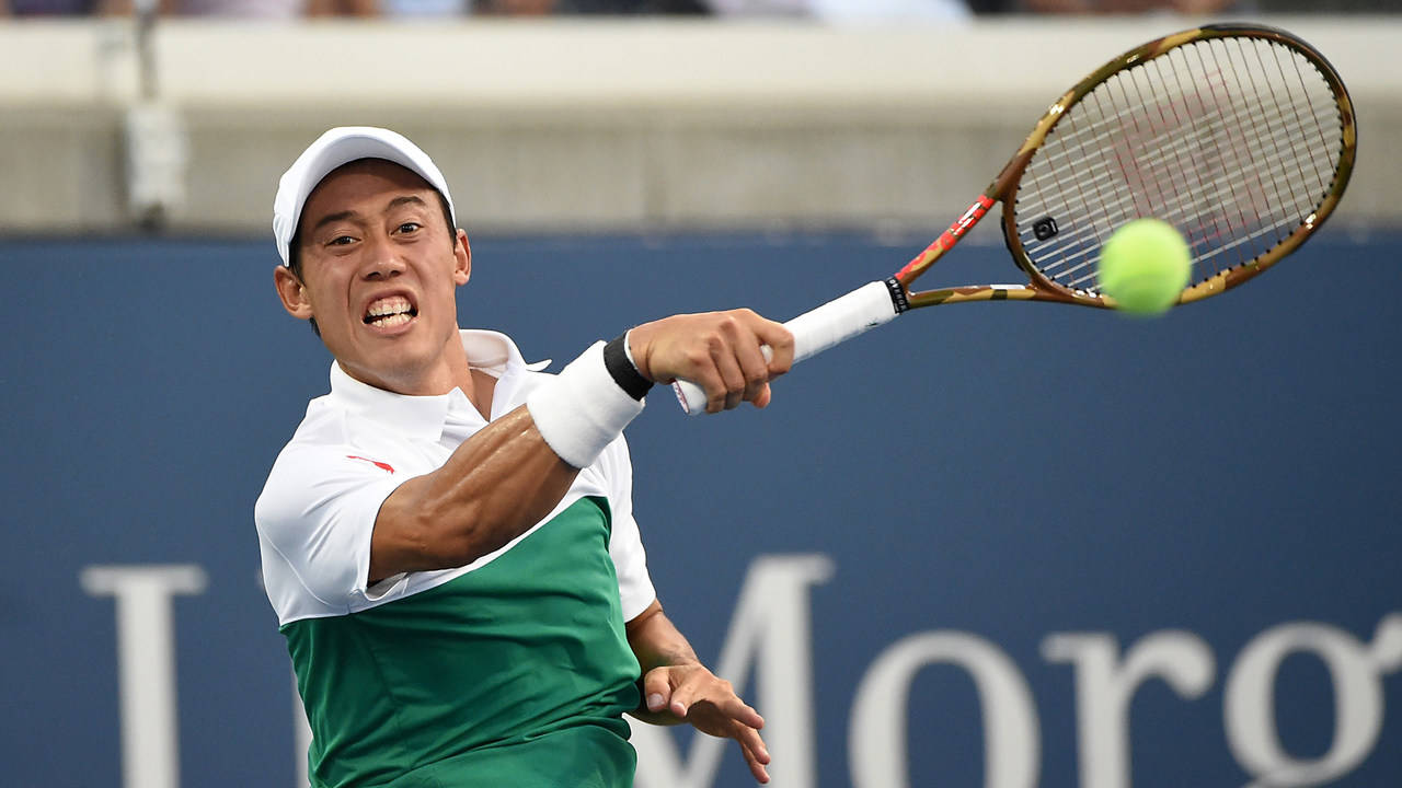 Caption: Kei Nishikori Executes A Dynamic Backhand Stroke. Wallpaper