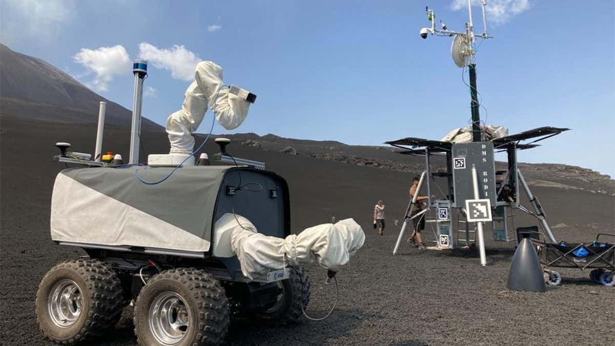 Caption: Lunar Rover Exploring The Moon's Surface Wallpaper