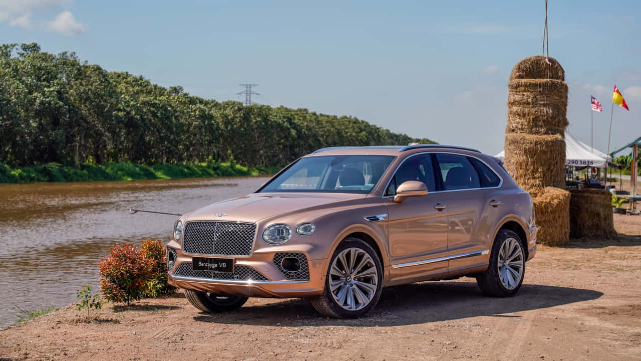 Caption: Luxurious Bentley Bentayga In Action Wallpaper