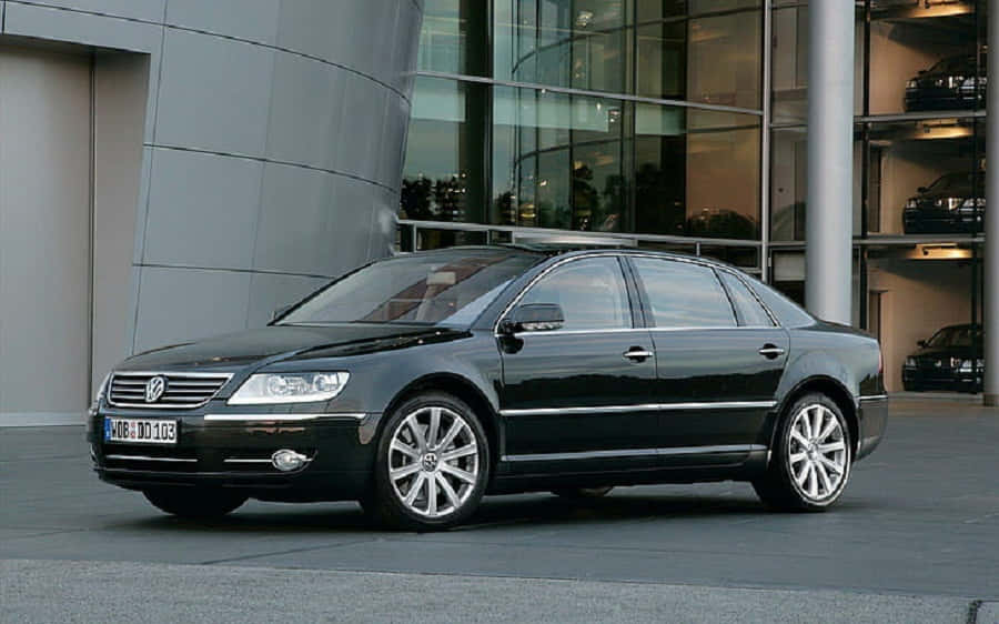 Caption: Luxurious Volkswagen Phaeton Gliding Across A Stunning Countryside Landscape. Wallpaper