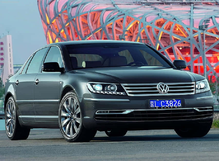 Caption: Luxurious Volkswagen Phaeton Gliding Through The Serene Countryside Wallpaper