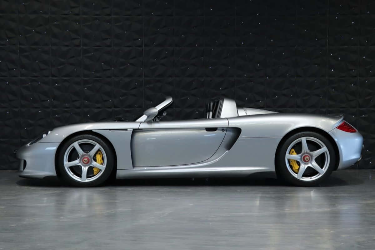 Caption: Majestic Porsche Carrera Gt Showcasing Its Grandeur Wallpaper