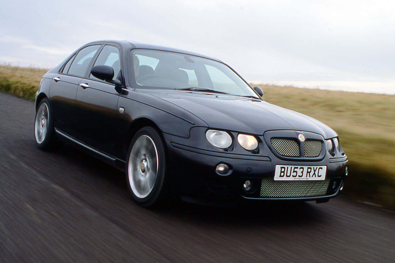 Caption: Majestic Shot Of Mg Zt On Open Road Wallpaper