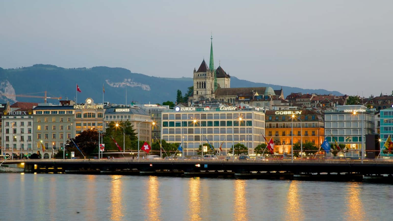 Caption: Majestic View Of Jet D'eau Fountain On Lake Geneva Wallpaper