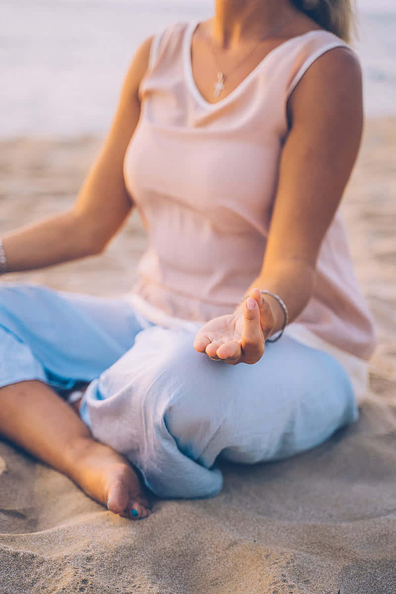 Caption: Mindful Practice - Woman Engaged In Yoga Wallpaper