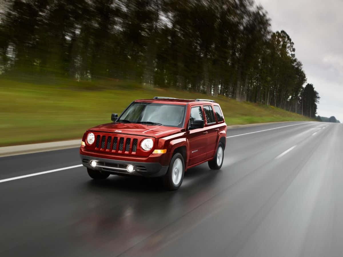 Caption: Off-road Adventure With Jeep Patriot Wallpaper