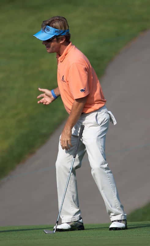 Caption: Professional Golfer Brett Quigley Focused On The Course Wallpaper